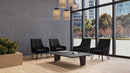 Black Oslo Scandinavian fabric reception chair by Nautilus Designs, showcasing a modern, sleek lounge seating with wooden legs.