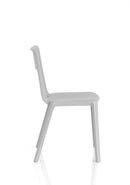 Dynamic Nest Edge Stacking Cafe & Bistro Chair with wooden armrests and black metal legs, shown in a modern outdoor setting.