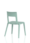 Dynamic Nest Edge stacking cafe and bistro chair with a sleek design and wooden legs, suitable for indoor and outdoor seating.