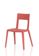 Dynamic Nest Edge stacking cafe and bistro chair with wooden armrests and metal frame, shown in a modern outdoor setting.