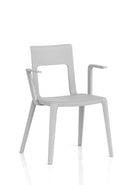 Dynamic Nest Edge stacking cafe and bistro chair with arms, featuring a sleek design and sturdy construction, shown from the front.