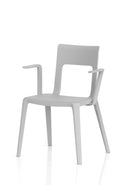 Dynamic Nest Edge stacking cafe and bistro chair with arms, featuring a modern design and sturdy frame, shown in a close-up view.