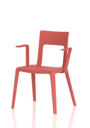 Dynamic Nest Edge stacking cafe and bistro chair with arms, shown in a modern outdoor setting with a sleek metal frame and comfortable seat.