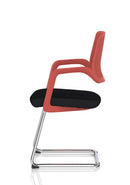 Dynamic Cosmo Cantilever Chair with sleek metal frame and cushioned seat, shown in a modern office setting.