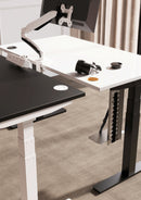 Dynamic Volta round pop-up power unit with 4 sockets and wireless charger on a desk accessory with a sleek design.
