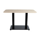 Extrema Premium dining table by ZAP with rectangular beige travertine top and black Anzio base, shown from side view.