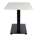Extrema Premium dining table by ZAP with white marble tabletop and black Anzio base, rectangular shape, side view.