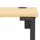 Dynamic Air Lite height adjustable slimline desk in maple with cable ports, featuring a modern design and a sleek, durable surface.