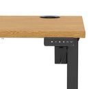 Dynamic Air Lite height adjustable slimline oak desk with cable ports, featuring a modern design and sleek workspace functionality.