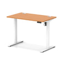 Dynamic Air Lite height adjustable slimline desk with cable ports in beech finish, featuring a modern design and sleek workspace.