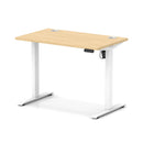 Dynamic Air Lite height adjustable slimline desk in maple with cable ports, showcasing its sleek design and modern workspace features.