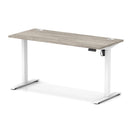 Dynamic Air Lite height adjustable slimline desk in grey oak with cable ports, featuring a modern, sleek design for versatile workspace use.