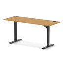 Dynamic Air Lite height adjustable slimline oak desk with cable ports, featuring a sleek modern design and smooth adjustment mechanism.