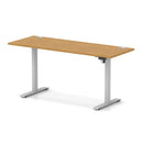Dynamic Air Lite height adjustable slimline desk in oak with cable ports, featuring a sleek modern design and adjustable height.