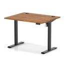 Dynamic Air Lite height adjustable desk with walnut finish and built-in cable ports, showcasing a modern ergonomic office workspace.