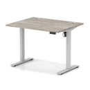 Grey oak Air Lite height adjustable desk by Dynamic with cable ports, featuring a modern design and ergonomic workspace.