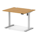 Dynamic Air Lite height adjustable desk with cable ports in oak finish, showcasing its sleek surface and ergonomic design.
