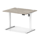 Dynamic Air Lite height adjustable desk in grey oak finish with cable ports, showcasing a modern ergonomic workspace solution.