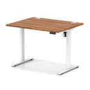 Dynamic Air Lite height adjustable desk with walnut finish and cable ports, showcasing a modern ergonomic workspace setup.