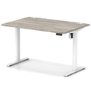Dynamic Air Lite height adjustable desk in grey oak finish with cable ports, featuring a modern ergonomic design.