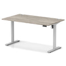 Dynamic Air Lite height adjustable desk with cable ports in grey oak finish, featuring a modern design and ergonomic workspace.