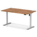 Dynamic Air Lite height adjustable desk with walnut finish and built-in cable ports, featuring a sleek, modern design.