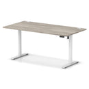 Dynamic Air Lite height adjustable desk in grey oak finish with cable ports, featuring a sleek modern design.