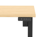 Dynamic Air Lite height adjustable desk with scalloped maple edge, featuring a modern ergonomic design and smooth surface.