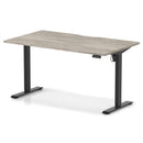 Dynamic Air Lite height adjustable desk with scalloped edge in grey oak finish, showcasing sleek modern design and adjustable height feature.
