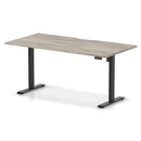 Dynamic Air Lite height adjustable desk with scalloped edge in grey oak finish, showcasing sleek modern design and smooth surface.