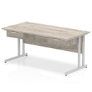 Dynamic Impulse cantilever straight desk in grey oak with two one-drawer fixed pedestals, featuring a modern office workspace.