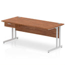 Dynamic Impulse cantilever straight desk in walnut with a single drawer pedestal, showcasing a modern office workspace.