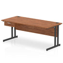 Dynamic Impulse cantilever straight desk with single drawer pedestal in walnut wood finish, showcasing a modern office workspace.