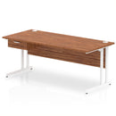 Dynamic Impulse cantilever straight desk with walnut finish and single drawer pedestal, showcasing a modern office workspace.