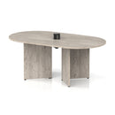 Impulse Volta boardroom table with grey oak finish, arrowhead metal legs, and integrated pop-up power module, by Dynamic.