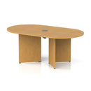 Dynamic Impulse Volta Boardroom Table with Oak finish, arrowhead legs, and pop-up power module in a professional conference room setting.