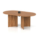 Dynamic Impulse Volta boardroom table with walnut finish and arrowhead legs, featuring a pop-up power module for conference rooms.