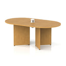 Dynamic Impulse Volta Boardroom Table with oak finish and arrowhead legs featuring a pop-up power module, shown from a front view.