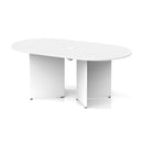 White Impulse Volta Boardroom Table with arrowhead legs and pop-up power module, designed by Dynamic, in a professional conference room setting.