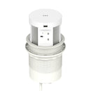 Dynamic Volta round pop-up power unit with four sockets and wireless charger, 120mm diameter, installed in a surface.