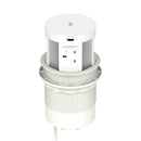 Dynamic Volta round pop-up power unit with four sockets and wireless charger, 120mm, installed in a modern setting.