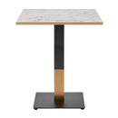 Omega Complete dining table by ZAP with white Carrara marble tabletop and sleek black and gold metal square base.