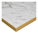 Omega complete dining table with white Carrara marble top and sleek black and gold base, featuring gold edge detail.