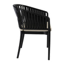 Black Portofino stacking armchair with taupe seat cushion by ZAP, shown from side angle.