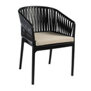 Black Portofino stacking armchair by ZAP with a taupe seat cushion, showcasing its sleek design and comfortable seating.