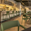 ZAP Portofino 75 bar stool with wooden legs and cushioned seat, shown in a modern kitchen setting.