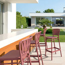 ZAP Portofino 75 bar stool with wooden legs and a cushioned seat, shown in a modern kitchen setting.