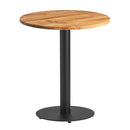 Solid oak round dining table with sleek black base, natural oak finish, modern design, by ZAP.