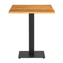 Solid oak dining table with natural finish and sleek black metal base, modern square design from ZAP's Character Oak collection.