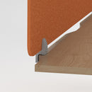 Dams Shush PET single desk screen clamp bracket attached to a desk, supporting a clear PET privacy screen for workspace separation.
